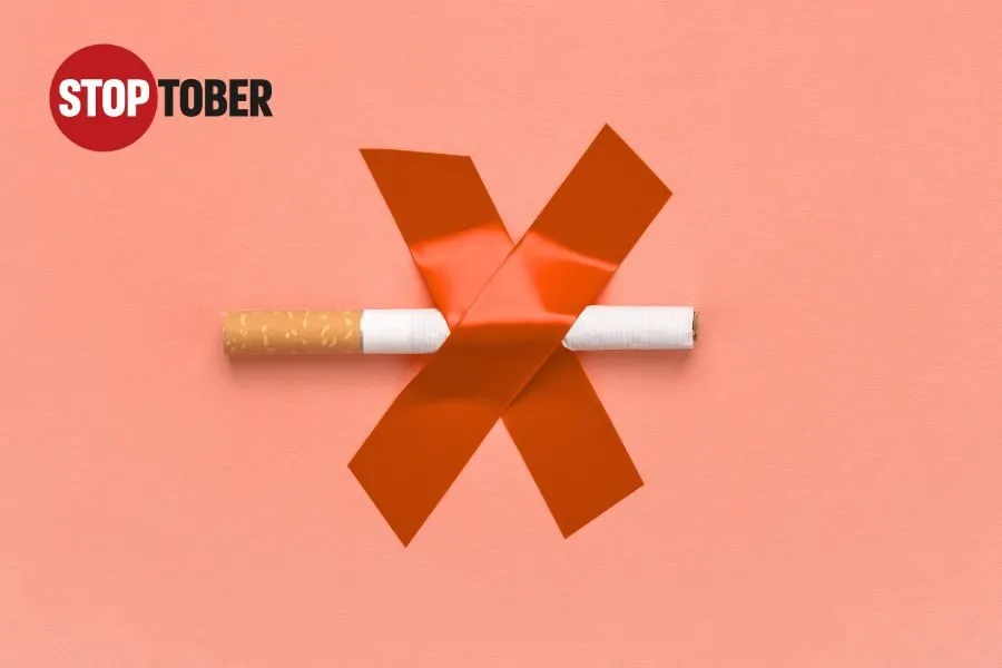 a cigarette taped to a wall