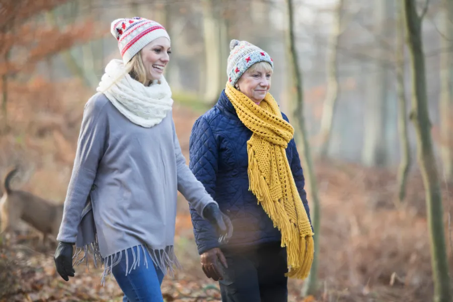 2 women walking outdoors in the winter